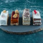 lot-pieces-delicious-cakes-wooden-board-high-quality-photo_11zon