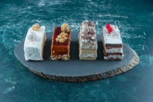 lot-pieces-delicious-cakes-wooden-board-high-quality-photo_11zon